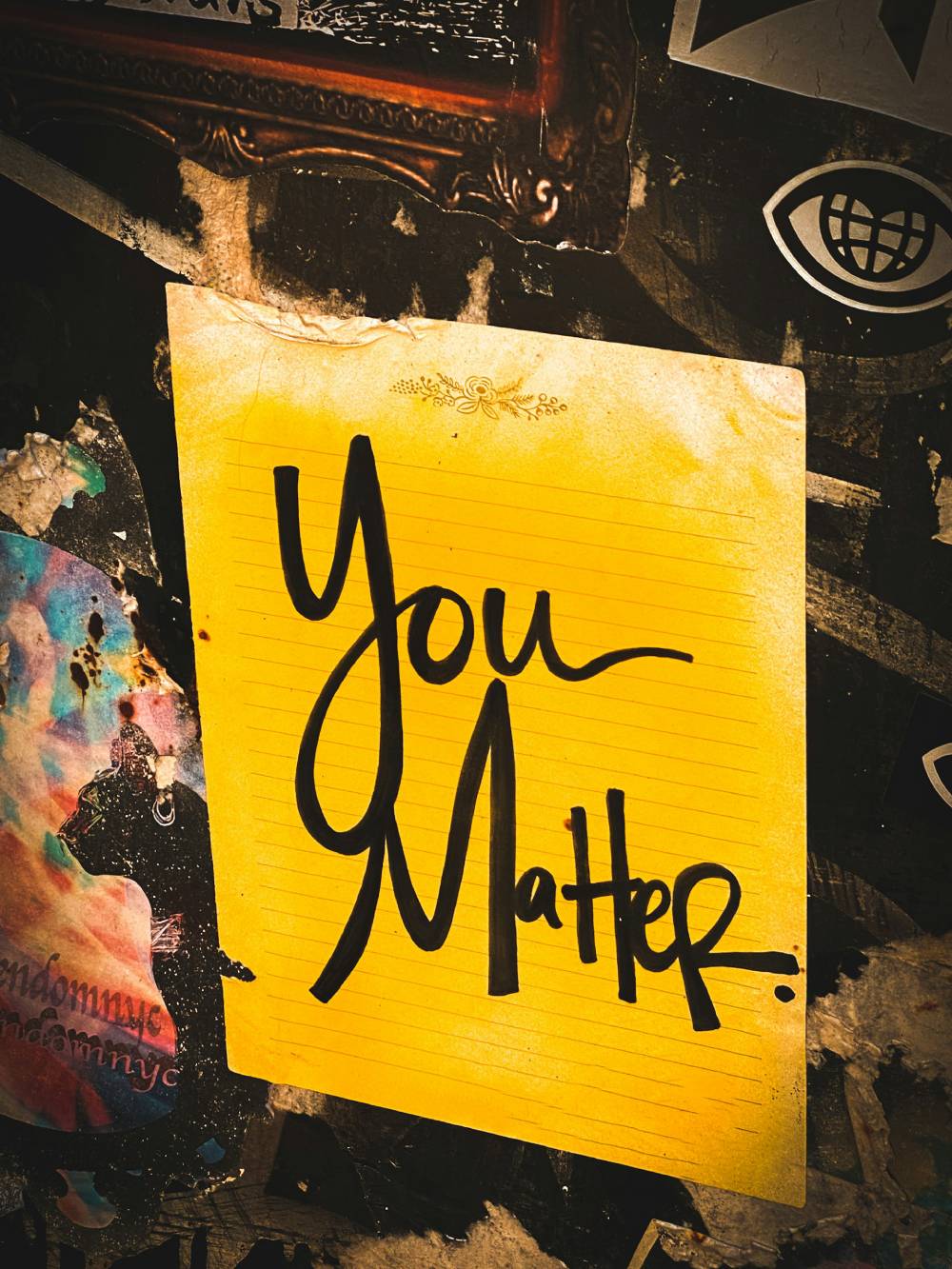 a yellow piece of paper with the words you matter written on it