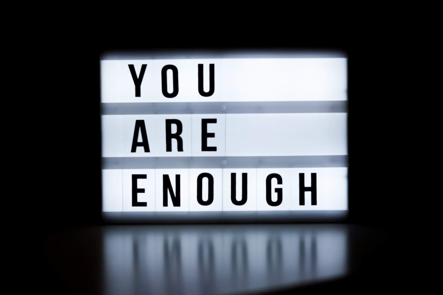 a lightbox with the words you are enough written on it
