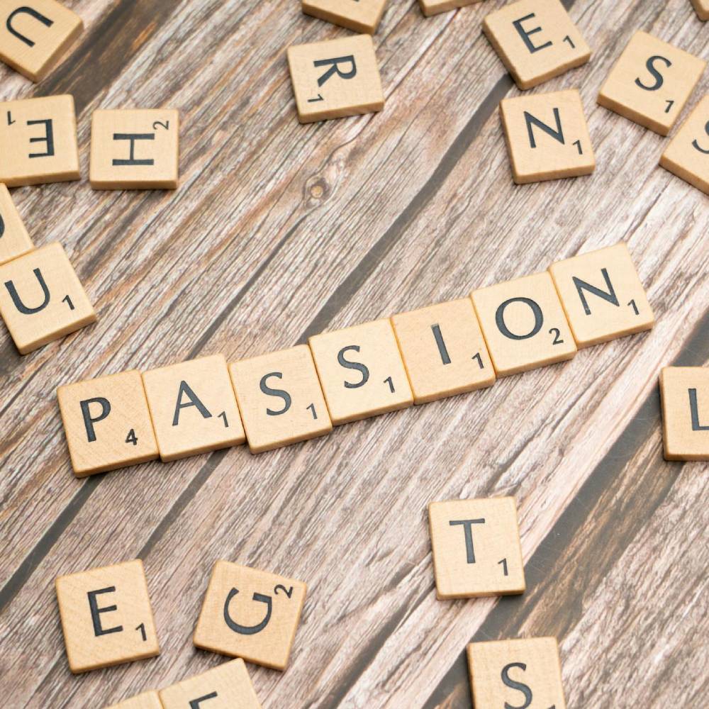 scrabble tiles spelling passion