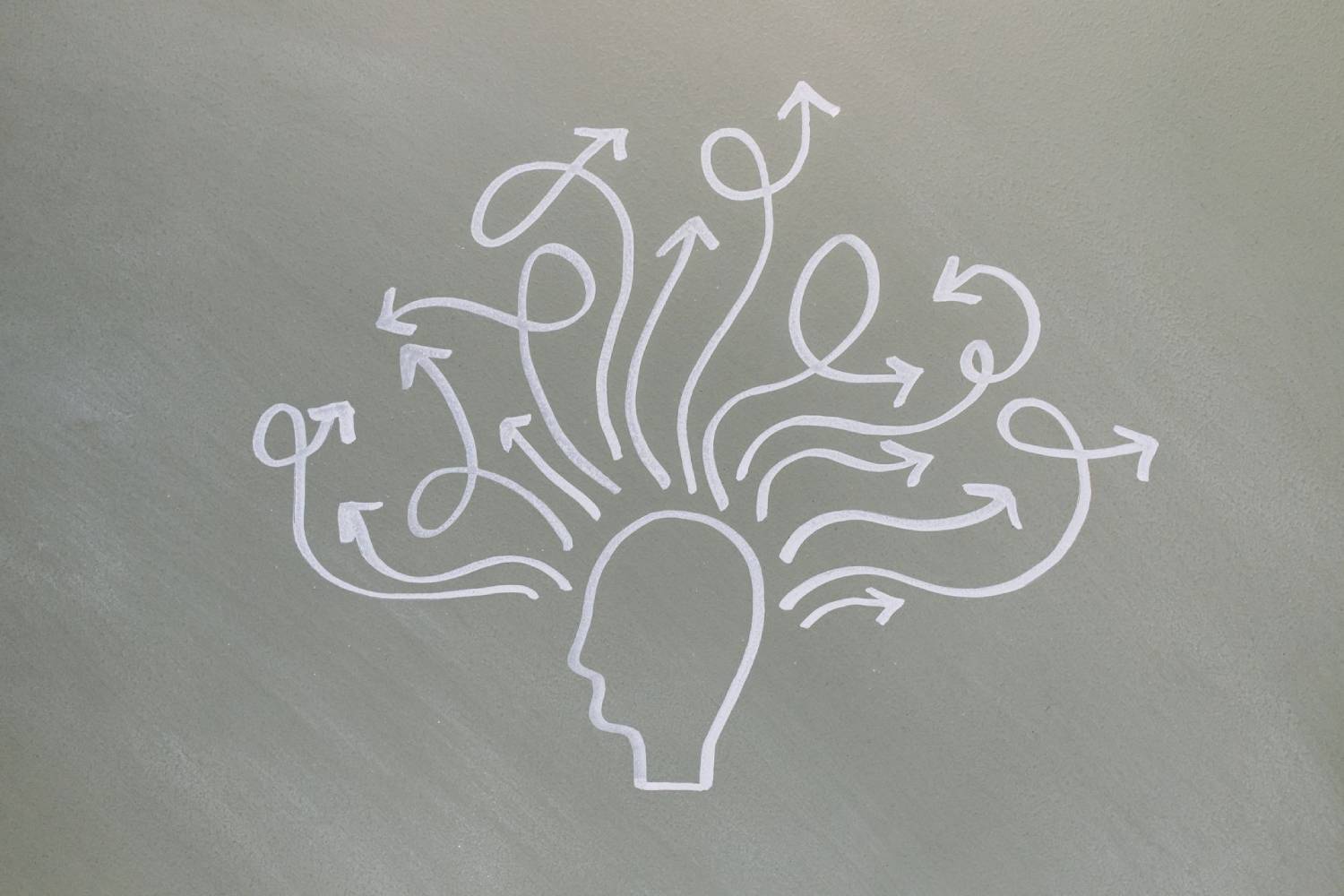 Illustration of a human head with multiple winding arrows branching outward, representing choices and different paths.